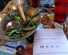plate of thai herbs and spices and copy of event menu
